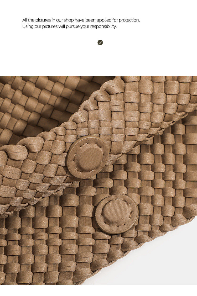 Close‑up of snap button detail on soft woven neoprene tote handbag