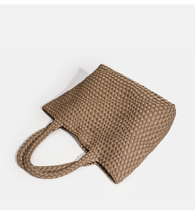side view of brown woven neoprene tote handbag